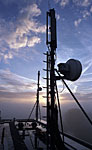 Sunrise against a telecom transmitter.